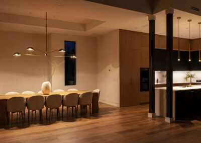 Modern luxury kitchen remodeling by Empire Builders Florida with custom cabinetry and island, High-end kitchen remodel by Empire Builders Florida featuring modern wood cabinetry, Custom kitchen renovation in Florida with modern lighting and open-concept design, Luxury kitchen remodeling project with island seating by Empire Builders Florida, Contemporary kitchen and dining remodel with warm wood finishes and modern lighting, Open-concept kitchen remodel showcasing custom cabinets and modern fixtures