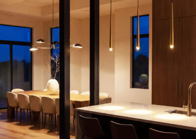 Modern luxury kitchen remodeling by Empire Builders Florida with custom cabinetry and island, High-end kitchen remodel by Empire Builders Florida featuring modern wood cabinetry, Custom kitchen renovation in Florida with modern lighting and open-concept design, Luxury kitchen remodeling project with island seating by Empire Builders Florida, Contemporary kitchen and dining remodel with warm wood finishes and modern lighting, Open-concept kitchen remodel showcasing custom cabinets and modern fixtures